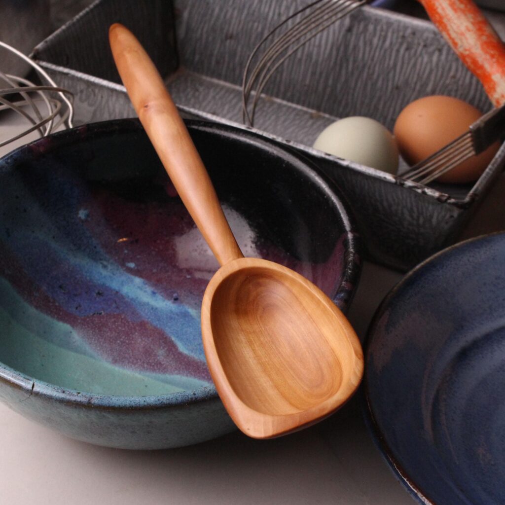 Handmade treenware wooden stirring spoon carved from salvaged Apple wood with a spatula end